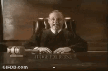 Judge Smiling At Desk GIF