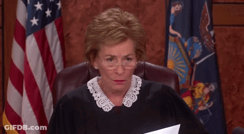 Judge Smiling At Desk GIF