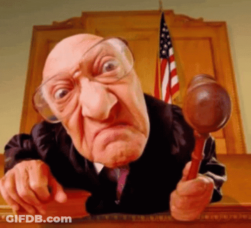 Judge With Glasses Holding Wooden Gavel GIF