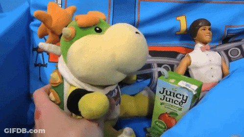 Juice Box Beside Stuffed Animal And Doll GIF