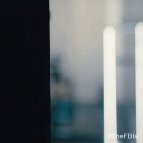 Julian McMahon Sneaking Behind Wall FBI GIF