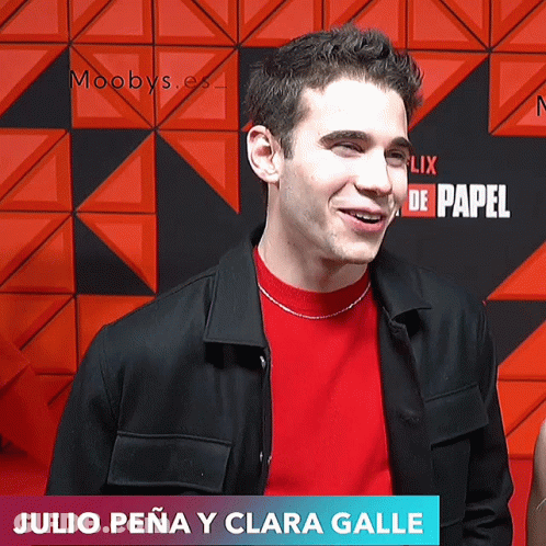 Julio Peña Y Clara Galle Smiling At Netflix Sign GIF