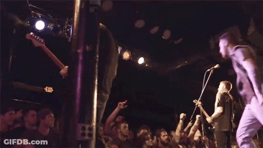 Jumping To The Concert Crowd GIF