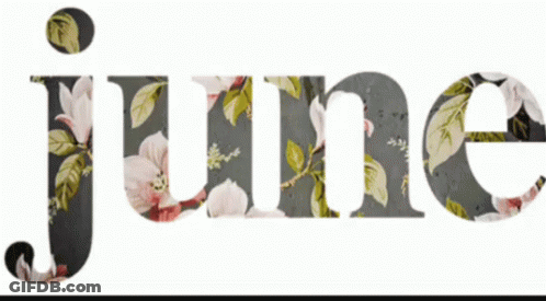June Surrounded By Flowers And Leaves GIF