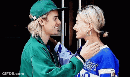 Justin Bieber And Hailey Baldwin Are Looking At Each Other And Smiling . GIF