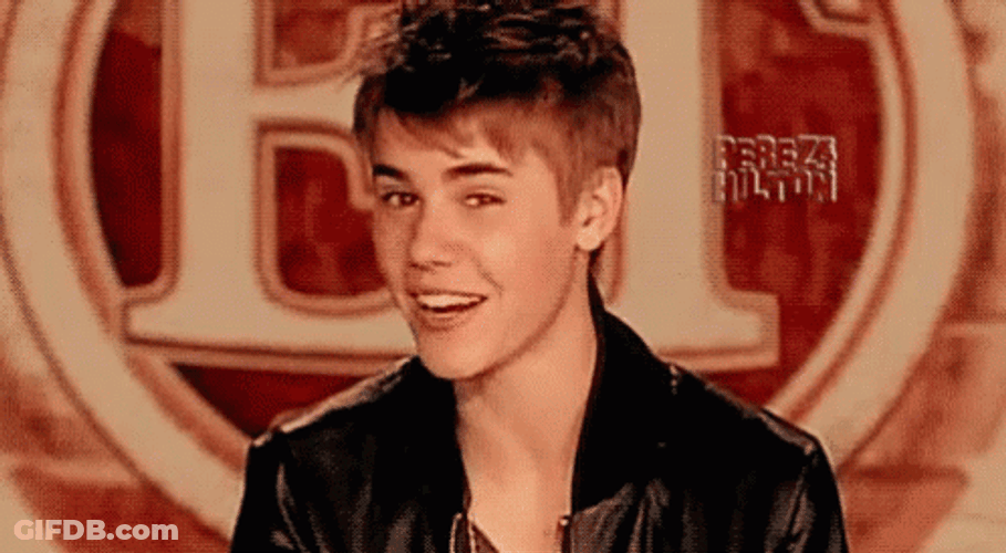 Justin Bieber Doing Eye Winking And Smiling GIF