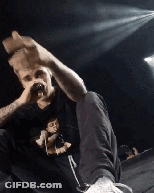 Justin Bieber Holding Microphone And Pointing GIF
