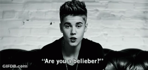 Justin Bieber Is Sitting On A Couch In A Black And White Photo And Says `` Are You A Believer ? '' GIF