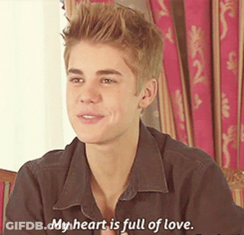 Justin Bieber Is Smiling And Saying " My Heart Is Full Of Love " GIF