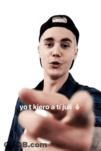 Justin Bieber Is Wearing A Black Hat And Plaid Shirt And Pointing GIF