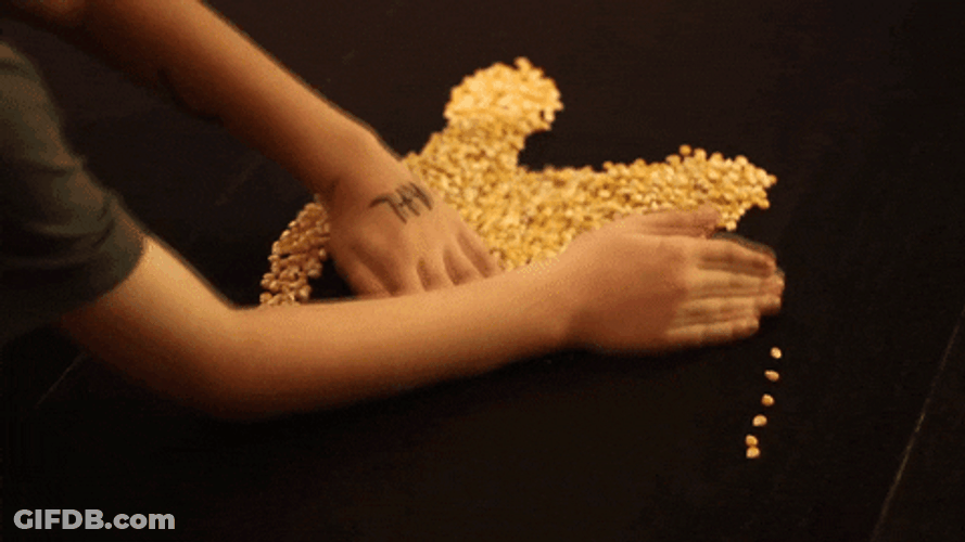 K In Gold Glitters Arranged GIF