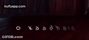 Kaadhale Written In White On Dark Background GIF