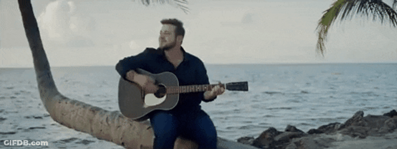 Kameron Marlowe Playing Guitar On Palm Tree GIF