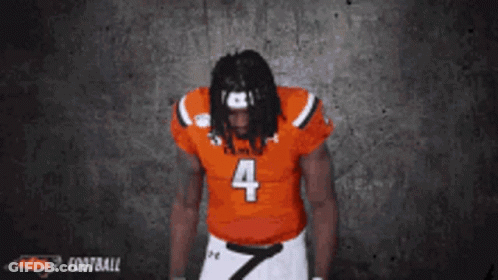 Kansas Football Player Number 4 Hands In Pockets GIF