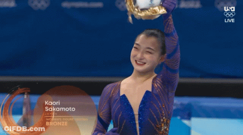 Kaori Sakamoto Is Holding A Trophy In Her Hand GIF