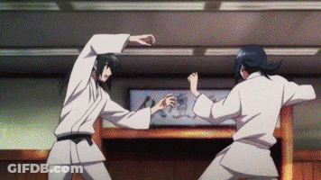 Karate Fighters In Front Of Sign GIF