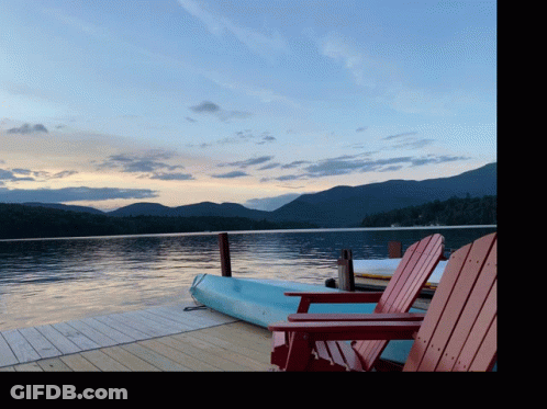 Kayak On Dock Next To Chairs GIF