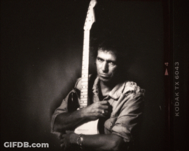 Keith Richards Cuddling Guitar Album Cover GIF