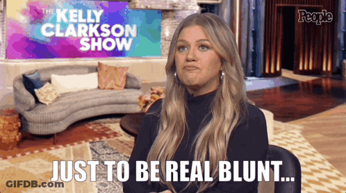 Kelly Clarkson Says Just To Be Real Blunt In Front Of A Couch GIF