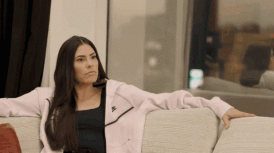 Kelsey Plum Sitting On A Couch GIF
