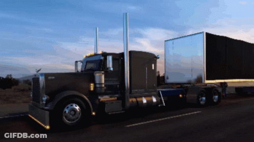 Kenworth Semi Truck Driving Down Road GIF