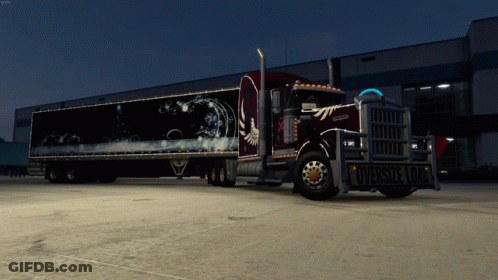 Kenworth Semi Truck Parked In Front Of Building GIF