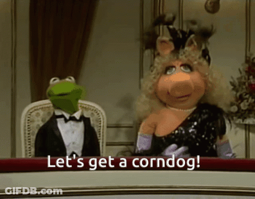 Kermit And Miss Piggy At Table Saying Let's Get A Corndog GIF