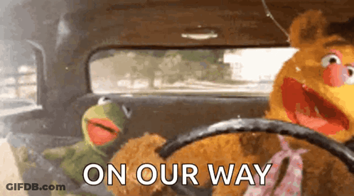 Kermit The Frog And Fozzie Bear Are Driving A Car With The Words On Our Way Written On The Side GIF