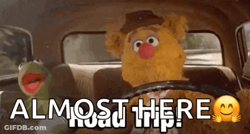 Kermit The Frog And Fozzie Bear Are Sitting In The Back Seat Of A Car With The Words Almost Here Written On The Bottom GIF