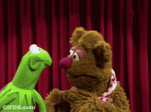 Kermit The Frog And Mrs. Bean Are Standing Next To Each Other In Front Of A Red Curtain GIF