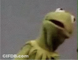 Kermit The Frog From Sesame Street Is Looking At The Camera With His Mouth Open . GIF