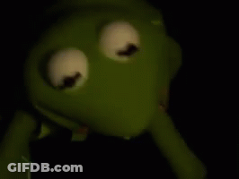 Kermit The Frog From The Muppet Show Is Holding A Syringe In His Mouth . GIF