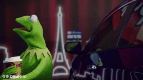 Kermit The Frog Holding Coffee In Front Of Purple Car GIF