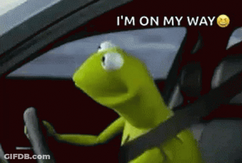 Kermit The Frog Is Driving A Car With The Words I 'M On My Way Above Him GIF