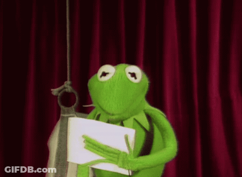 Kermit The Frog Is Holding A Piece Of Paper In His Hands GIF