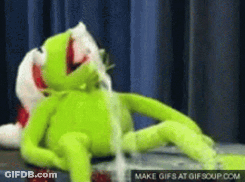 Kermit The Frog Is Laying Down With His Mouth Open And A Gif Is Being Made At Gifsoup.com GIF