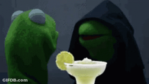 Kermit The Frog Is Looking At A Margarita With A Slice Of Lime In It GIF
