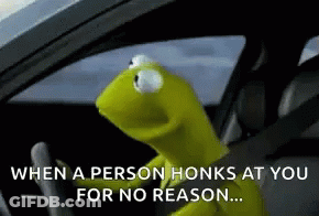 Kermit The Frog Is Sitting In The Driver 'S Seat Of A Car . GIF