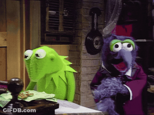 Kermit The Frog Is Sitting Next To A Stuffed Animal GIF