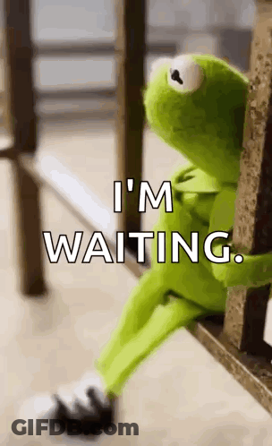 Kermit The Frog Is Sitting On A Bench With The Words `` I 'M Waiting '' Written Above Him . GIF