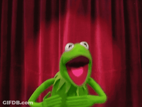 Kermit The Frog Is Standing In Front Of A Red Curtain With A White Object Hanging From It GIF