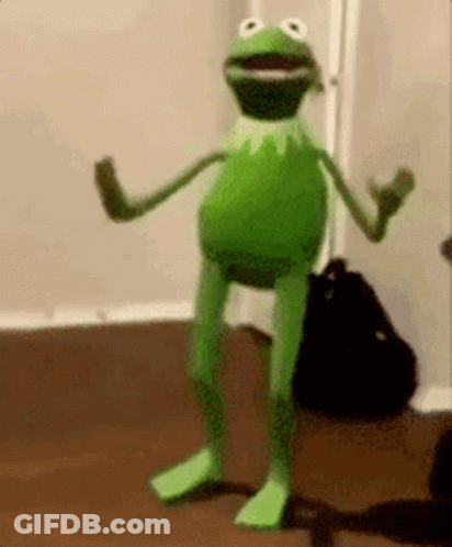 Kermit The Frog Is Standing On Its Hind Legs In A Room . GIF