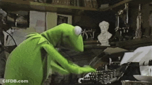 Kermit The Frog Is Typing On A Typewriter . GIF