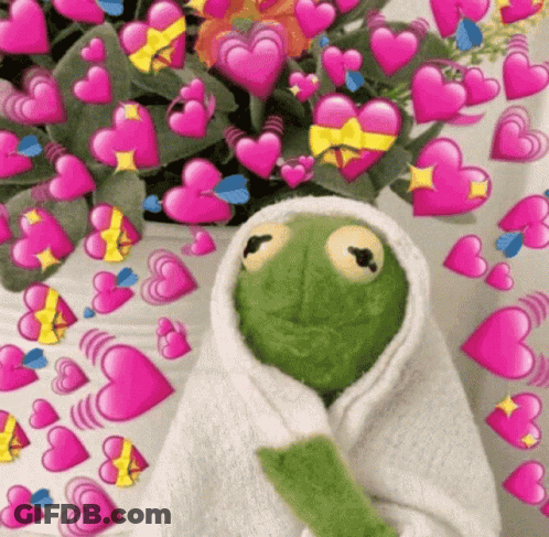 Kermit The Frog Is Wrapped In A Towel And Surrounded By Hearts . GIF