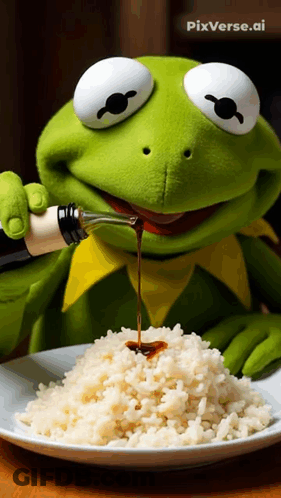 Kermit The Frog Pouring Sauce Over Rice GIF