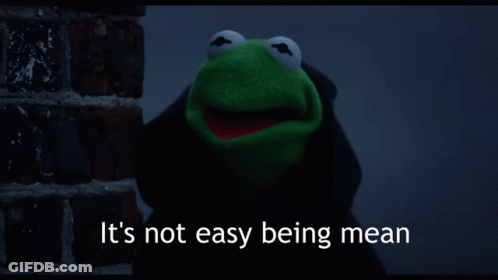 Kermit The Frog Says It 'S Not Easy Being Mean While Standing Next To A Brick Wall GIF