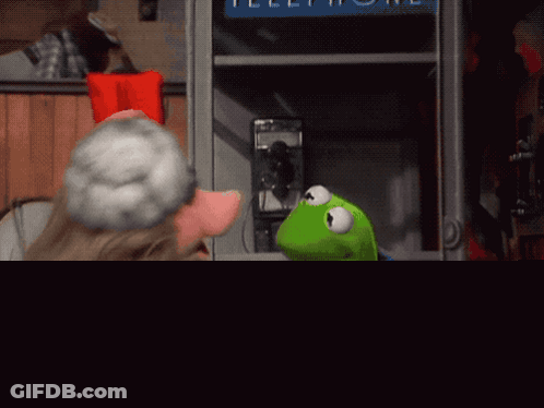 Kermit The Frog Sitting At Table With Kermit Cup GIF