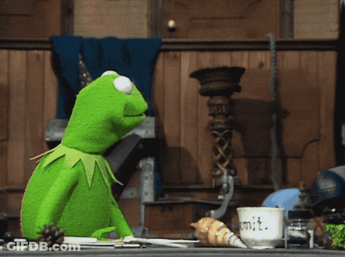 Kermit The Frog Sitting At Table With Unit Cup GIF