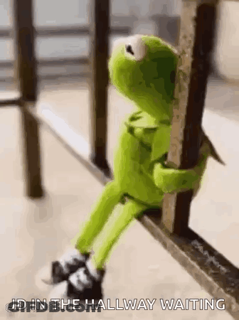 Kermit The Frog Sitting On Railing Waiting GIF