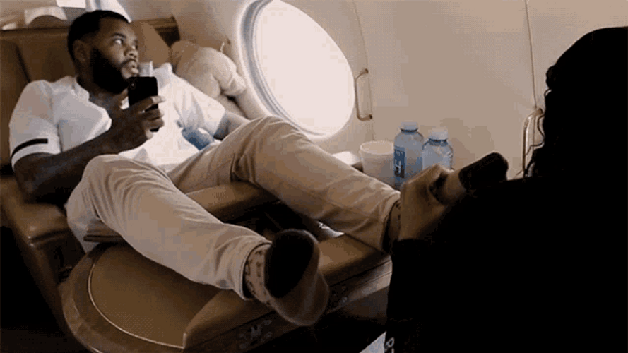 Kevin Gates Gets Foot Massage On Flight GIF